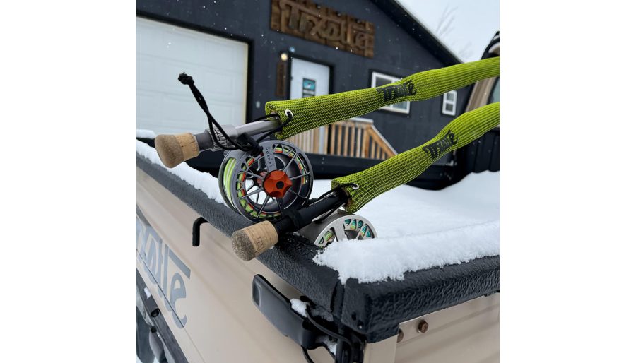 Fly rods in Trxstle Rod Boots, mounted on vehicle hood.